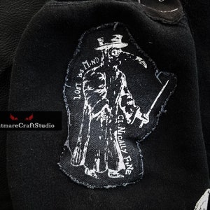May include: Black and white embroidered patch of a plague doctor wearing a long coat, hat, and mask. The text "LOST HIS MIND" is on the left side of the patch and "CLINICALLY FINE" is on the right side.