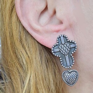 May include: A set of three ceramic nesting bowls in shades of blue, green, and white. The bowls feature a speckled glaze and a simple, modern design. The largest bowl measures approximately 6 inches in diameter.