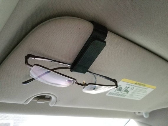 pinza sujeta gafas para el coche