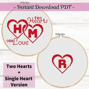 May include: Two embroidery hoop patterns for cross stitch. The first pattern shows two red hearts with the letters "H" and "M" inside, with the text "two hearts one love". The second pattern shows a single red heart with the letter "R" inside.