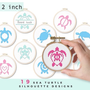 May include: Nine 2-inch embroidery hoops with different sea turtle designs. The designs include a blue turtle with a swirl, a pink turtle with a heart, a blue turtle with a flower, a pink turtle with a shell, a blue turtle with a swirl, a pink turtle with a shell, a blue turtle with a flower, a pink turtle with a heart, and a blue turtle with a swirl. The hoops are arranged in a circle around the text "19 Sea Turtle Silhouette Designs".
