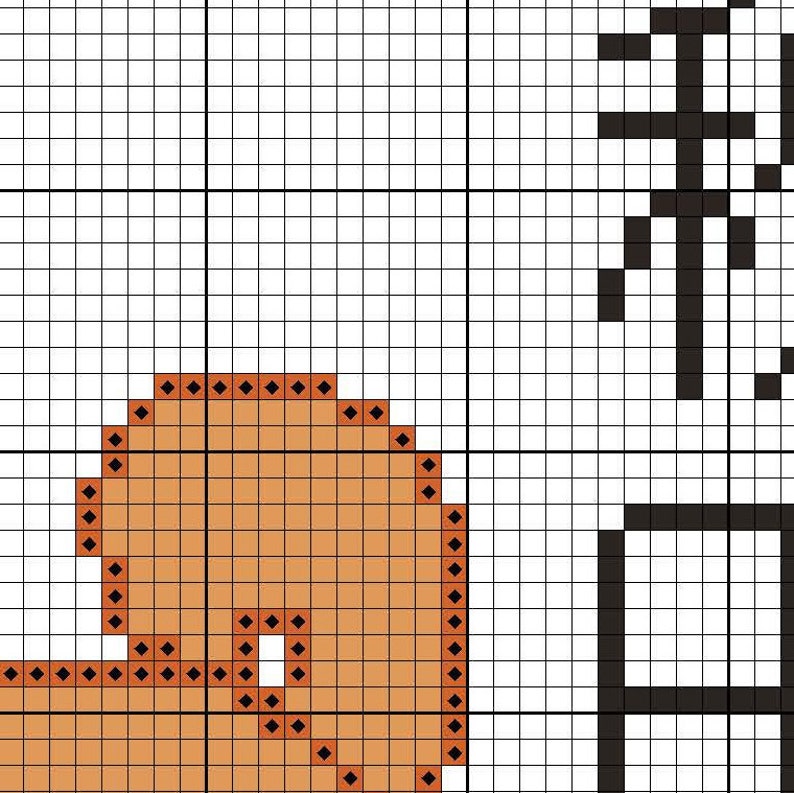 May include: A cross-stitch pattern featuring a brown and orange design with a black outline. The pattern includes a curved shape with a small circle inside.