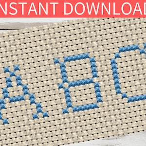May include: Cross stitch pattern of the letters A, B, and C in blue thread on a beige fabric background.