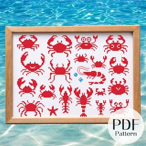 May include: A cross-stitch pattern featuring a variety of red crabs and lobsters. The pattern is framed in a wooden frame and is set against a blue water background. The text "PDF Pattern" is visible in the lower right corner of the image.