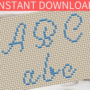 Può includere: Schema di punto croce per la parola "Aprile" in filo blu su una tela Aida beige.