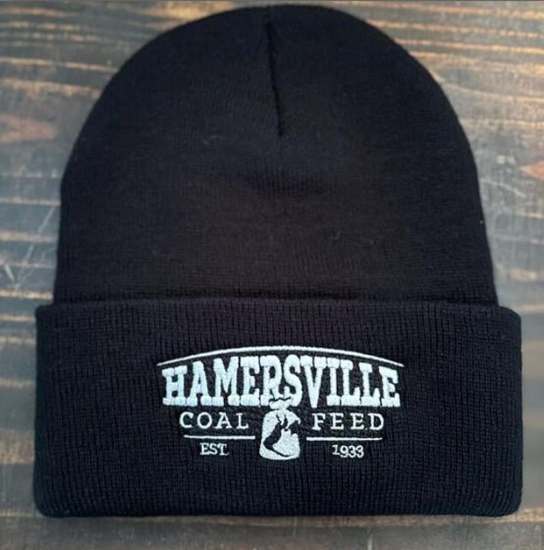 May include: Black knit beanie with a white embroidered logo that reads "Hamersville Coal Feed Est 1933".