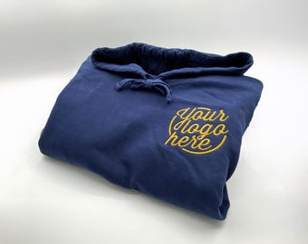 May include: A navy blue hooded sweatshirt with a gold embroidered circle that says "your logo here".