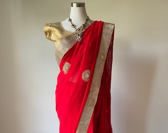 Red Sari With Gold Borders and Accents