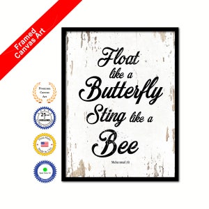 May include: Black and white framed canvas print with a white background and black text that reads "Float like a Butterfly Sting like a Bee" with the name Muhammad Ali at the bottom.
