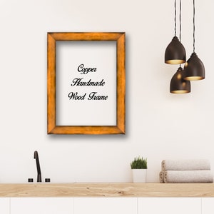 May include: A copper-colored wood picture frame with the text "Copper Handmade Wood Frame" inside the frame.
