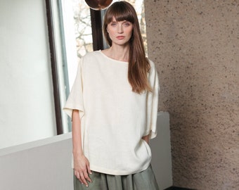 Oversized ivory linen blouse with elbow-length sleeves
