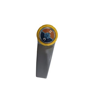 May include: A gray plastic handle with a yellow and orange circular knob. The knob has the letters "H" and "C" and a stylized image of a water droplet.