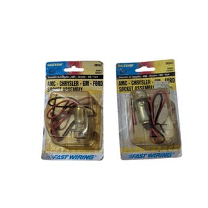 May include: Two automotive socket assemblies for AMC, Chrysler, GM, and Ford vehicles. Each assembly is packaged in a clear plastic blister pack with the "CALTERM" and "FAST WIRING" logos. The packages have a yellow and blue color scheme.