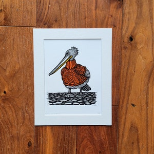 Pelican wearing a rusty orange jumper - handmade original linocut art print