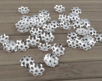300 caps 6 mm-cals014 silver colored metal