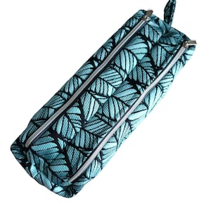 Astuccio con doppia zip, tessuto jacquard con motivi a fogliame, foderato