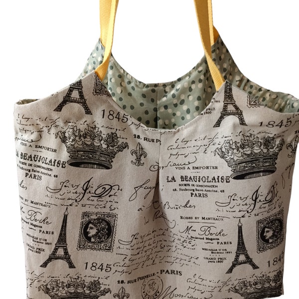 Sac panière ou cabas en tissu lin écru et coton avec motifs Tour Eiffel, .... doublée en coton avec  deux poches plaquées, anses jaunes