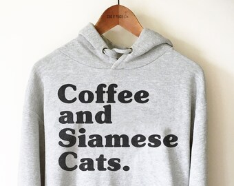 May include: A gray hooded sweatshirt with the text "Coffee and Siamese Cats." printed in black.
