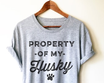 May include: Gray t-shirt with black text that reads "PROPERTY -OF MY- Husky" with a paw print below the text.
