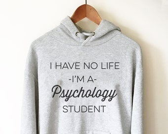 May include: Gray hooded sweatshirt with the text "I have no life - I'm a Psychology student" printed on the front.