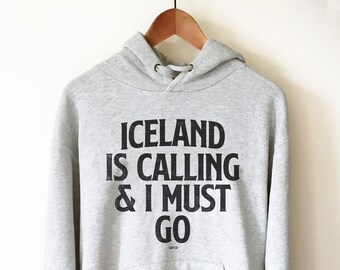 May include: Gray hooded sweatshirt with the text "ICELAND IS CALLING & I MUST GO" printed in black.