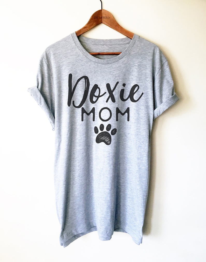 May include: Gray t-shirt with the text "Doxie Mom" in black script font and a black paw print below.