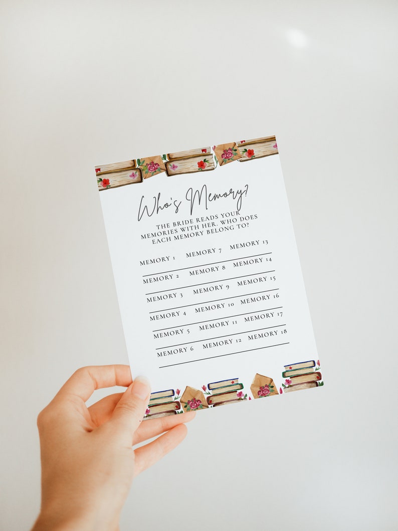 May include: A printable game card with the title "Who's Memory?" and instructions for a bridal shower game. The bride reads memories with her guests and they guess who each memory belongs to. The card is decorated with a watercolor illustration of books and roses.