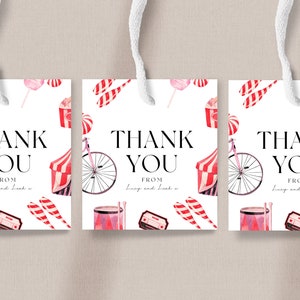 May include: Three white thank you tags with a circus theme. Each tag features a red and white striped tent, a pink and white striped candy cane, a pink and white cotton candy, a red and white striped popcorn bucket, a red and white striped drum, a red and white striped bicycle, and the text "Thank You" with "From" and a name below.