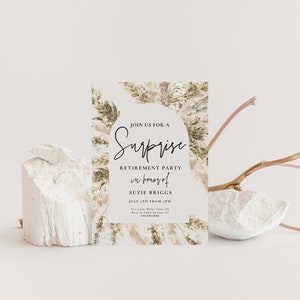 May include: A white card with a brown and beige watercolor background featuring a stylized illustration of pampas grass. The card is an invitation to a surprise retirement party for Suzie Briggs on July 5th. The text reads "Join us for a Surprise Retirement Party in honor of Suzie Briggs July 5th from 3 PM Fan Lone, Relas Town, CA Keep it a secret from Suzie!"