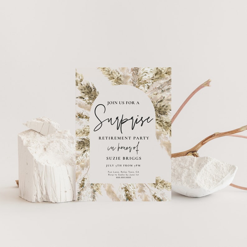 May include: A white card with a brown and beige watercolor background featuring a stylized illustration of pampas grass. The card is an invitation to a surprise retirement party for Suzie Briggs on July 5th. The text reads "Join us for a Surprise Retirement Party in honor of Suzie Briggs July 5th from 3 PM Fan Lone, Relas Town, CA Keep it a secret from Suzie!"