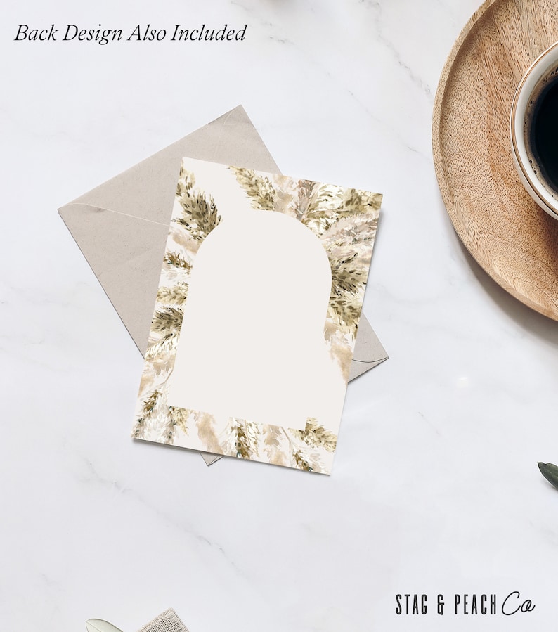 May include: A blank white card with a border of brown and beige watercolor leaves. The text "STAG & PEACH Co" is printed in black at the bottom of the card.