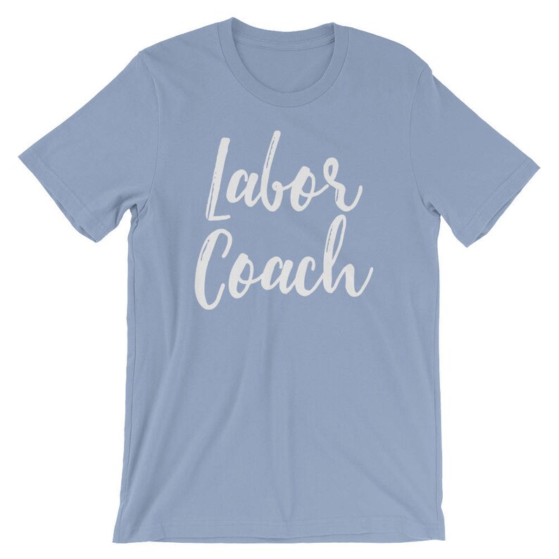 May include: Light blue t-shirt with the text "Labor Coach" in white lettering.