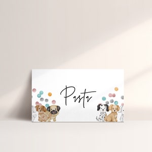 May include: A white card with the name "Pustv" written in black cursive. The card is decorated with colorful confetti and three cartoon dogs. The dogs are a pug, a dalmatian, and a brown and white dog.