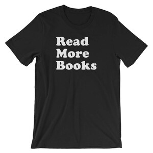 May include: Black t-shirt with white text that reads "Read More Books".