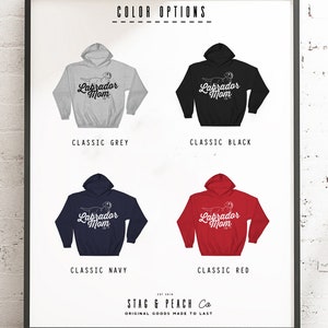 May include: A graphic design of a Labrador Retriever with the text "Labrador Mom" on a hoodie. The hoodie is available in five colours: classic grey, classic black, classic navy, classic red, and classic white.