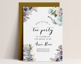May include: A white invitation card with a floral design and a teapot and teacups. The text reads "Join us for a tea party to celebrate the bride to be Anna Rose. Saturday August 7th | 2pm Shaft Hotel, Fancy Lane, NY Registered at Bridal World"