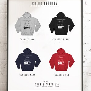 May include: A graphic design for a hoodie featuring a violin and the text "Never underestimate a girl who plays violin". The hoodie is available in five colors: classic grey, classic black, classic navy, classic red, and classic heather grey.