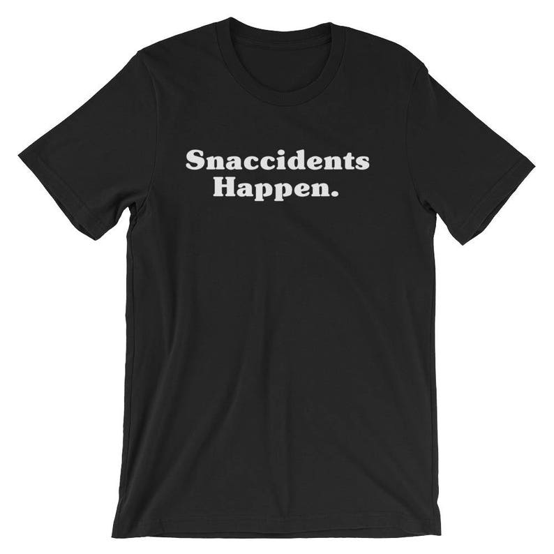 May include: Black t-shirt with white text that reads "Snaccidents Happen."