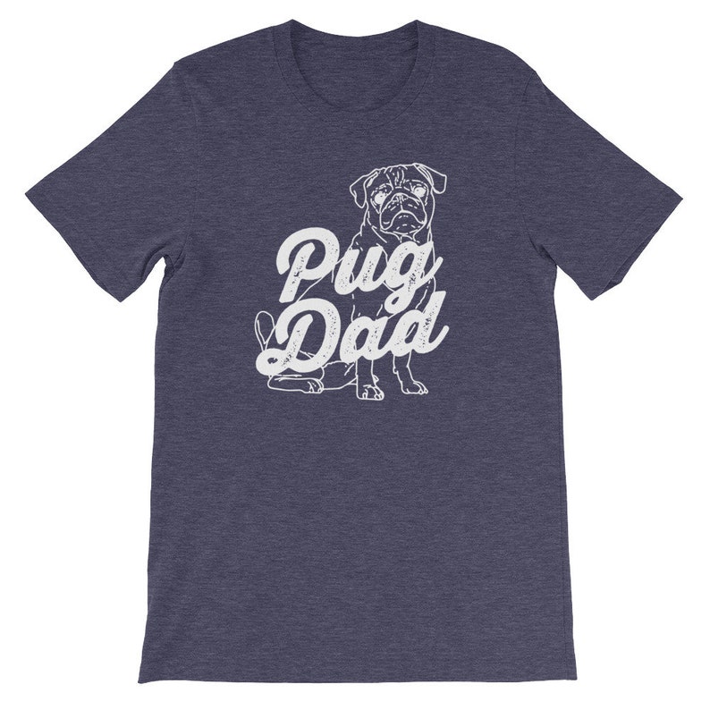 May include: A dark blue t-shirt with a white pug silhouette and the text "Pug Dad" in a vintage-style font.