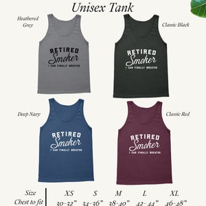May include: Unisex tank top in five colors: heather grey, classic black, deep navy, classic red, and white. The tank top features the text "Retired Smoker I Can Finally Breathe". The tank top is available in sizes XS (30-32 inches), S (34-36 inches), M (38-40 inches), L (42-44 inches), and XL (46-48 inches).