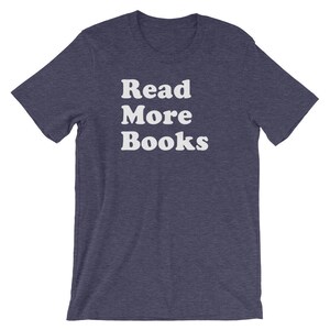 May include: A dark blue t-shirt with the text "Read More Books" in white.