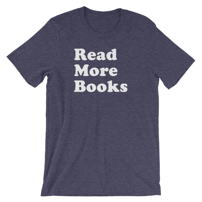May include: A dark blue t-shirt with the text "Read More Books" in white.