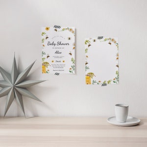 May include: A white baby shower invitation with a bee and honeycomb design. The invitation says "Join us for a Baby Shower in honor of Alice and her little bumblebees".