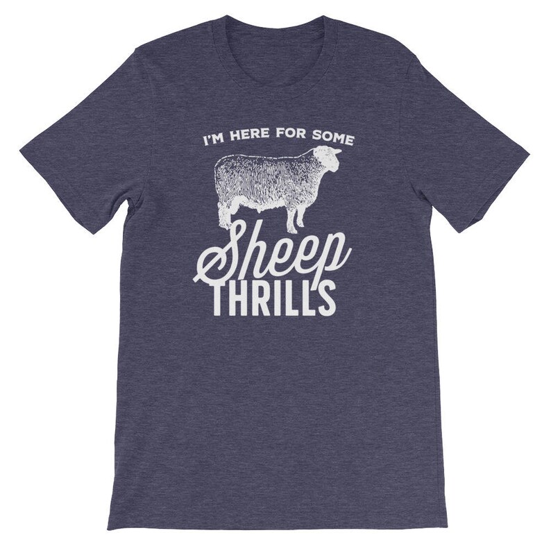 May include: A dark blue t-shirt with a white graphic of a sheep and the text "I'm here for some sheep thrills".