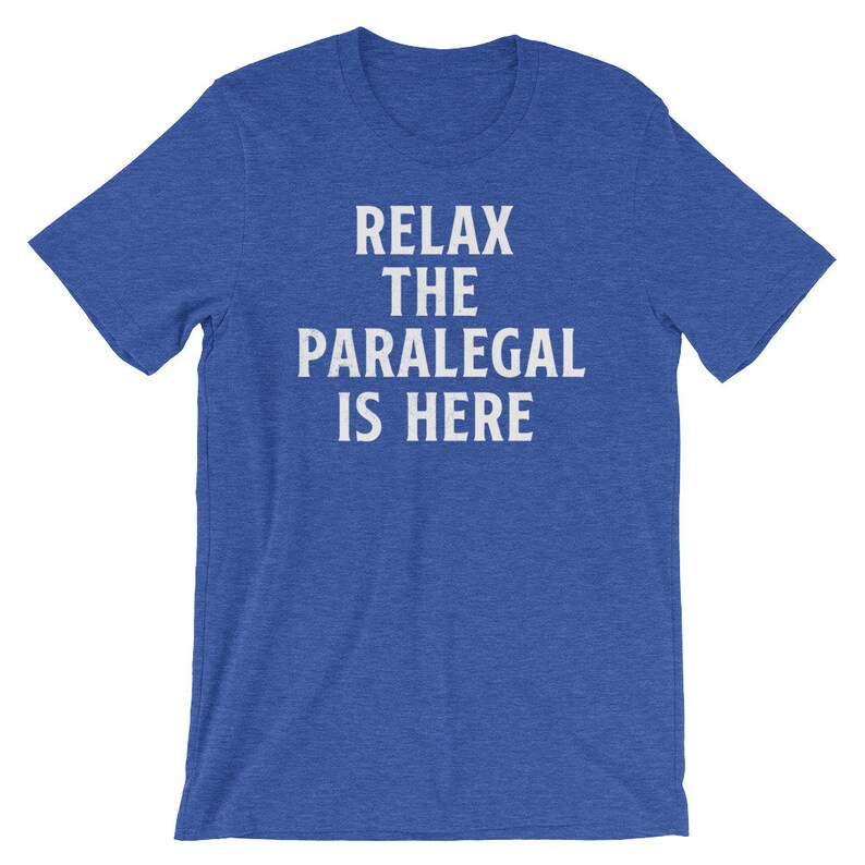 May include: A royal blue t-shirt with the text "Relax the Paralegal is Here" in white.