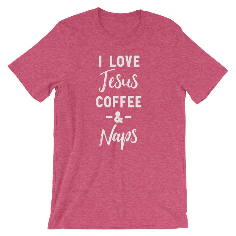 May include: A pink heather t-shirt with the text "I love Jesus Coffee & Naps" in white.