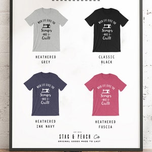 May include: A graphic t-shirt design with a sewing machine and the text "When life gives you scraps - make a quilt". The shirt is available in five colors: heather grey, classic black, heather ink navy, heather fuscia, and white.