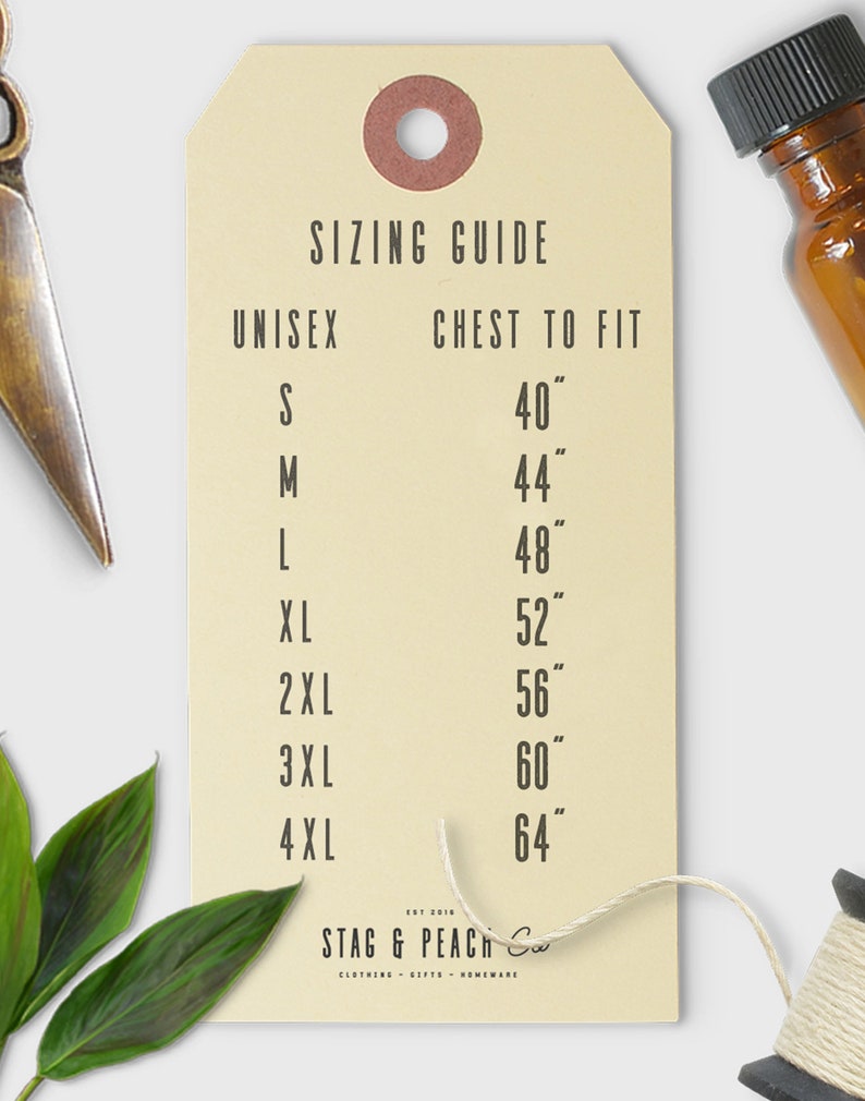 May include: A beige paper tag with a sizing guide for unisex clothing. The tag lists chest measurements in inches for sizes S through 4XL.