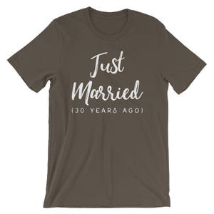 May include: A dark brown t-shirt with the text "Just Married (30 Years Ago)" in white.