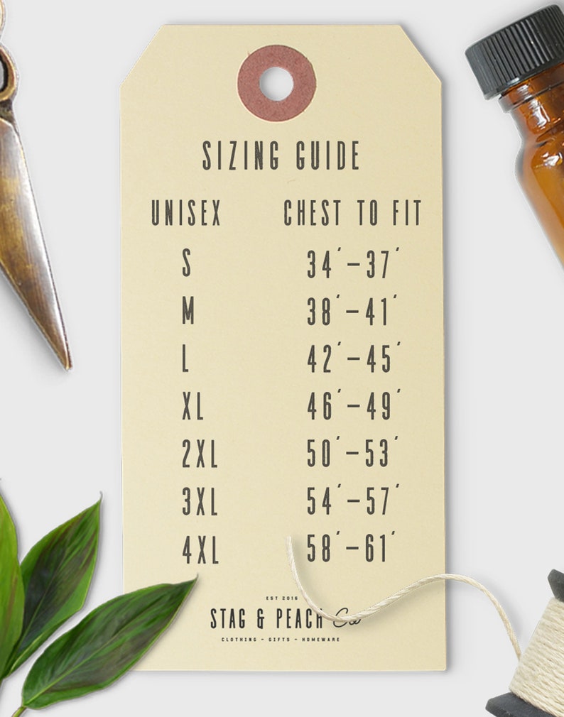 May include: A beige tag with a sizing guide for unisex clothing. The tag lists chest measurements in inches for sizes S through 4XL. The tag also includes the text "STAG & PEACH Co."